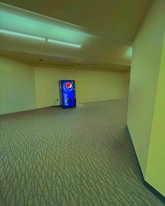 an empty room with a blue box on the floor