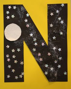 the letter n is made up of paper and stars