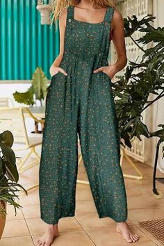 This Floral Print Dual Pockets Overall Jumpsuit is a charming and versatile addition to your wardrobe. With its casual button-front design, it effortlessly combines style and comfort. The floral print adds a touch of femininity, while the dual pockets provide practicality. Perfect for any occasion, this jumpsuit is a must-have. Green Jumpsuits With Pockets For Vacation, Green Jumpsuits And Rompers With Pockets For Vacation, Green Vacation Jumpsuits With Pockets, Green Buttoned Jumpsuits And Rompers, Spring Button-up Jumpsuits And Rompers With Buttoned Pockets, Cotton Wide-leg Jumpsuits And Rompers With Pockets, Casual Button-up Jumpsuits And Rompers With Pockets, Relaxed Fit Full-length Jumpsuits And Rompers With Pockets, Beach Wide-leg Jumpsuits And Rompers With Pockets