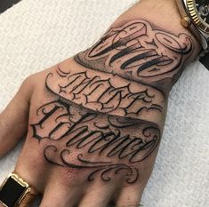 a hand with some writing on it