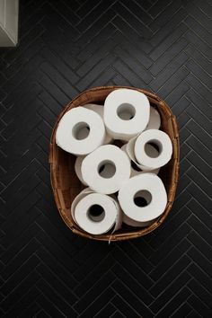 several rolls of toilet paper in a basket