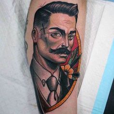 a man with a mustache and suit on his leg is shown in this tattoo design