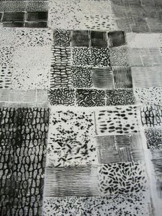 a black and white drawing of many different patterns on the ground, with one square in the middle