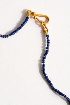 Our idea of the perfect stand necklace. Semi-precious Lapis Lazuli heishi beads strung long with 22k findings. 22k Gold closure & Findings + Lapis Lazuli Handmade in San Francisco Part of our core collection of fine jewelry for daily wear and what we consider to be wardrobe staples. Gold Single Strand Lapis Lazuli Beaded Necklace, Gold Hand-strung Heishi Beads Necklace, Heishi Beads, Bead Stringing, Bead Strand, Strand Necklace, 22k Gold, Lapis Lazuli, Wardrobe Staples