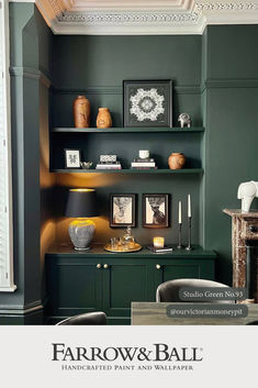 an image of a living room setting with green walls and shelves on the farrow & ball wallpaper