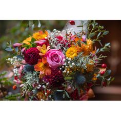 a bouquet of flowers is sitting on a table