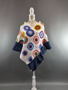 Upcycled knit granny square and frayed denim poncho. Super cute and colorful. One size fits most. One Size Casual Poncho For Spring, Casual Oversized Multicolor Poncho, Bohemian Knitted Poncho For Spring, Casual Multicolor Summer Poncho, Colorful Bohemian Poncho, One Size Hippie Crochet Poncho, Casual Knitted Spring Poncho, Casual Knitted Poncho For Spring, Casual One Size Poncho For Festivals