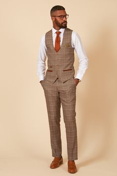 In a subtle light tan with a classic Prince of Wales check, this waistcoat is the perfect piece for any formal attire. The waistcoat features a bright gold Bubbles MD print lining to the back and has a complimentary matching pocket square, brown buttons and velvet trim to the pockets. Wear as part of the full three-piece suit for a cohesive look or mix-and-match to spice up a plainer suit. Model wears size 38R. Features Prince of Wales check Slim fit Single-breasted Five button fastening Two sid Wedding Guest Suits, Navy Suit Wedding, Wedding Suits For Men, Stylish Office Wear, Suit Model, Pocket Square Styles, Graduation Suits, Tweed Wedding Suits, Prince Of Wales Check