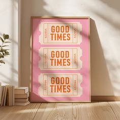 a pink poster with the words good times and good times on it next to books