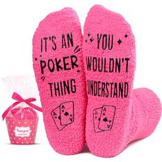 two pink socks that say it's an poker thing, and the words on them are