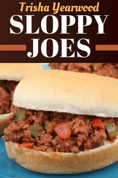 two sloppy joes on a blue plate with text overlay that reads, trisha yearwood sloppy joes