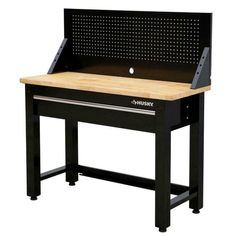 a black workbench with a wooden top