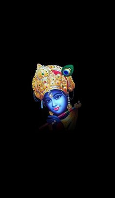 an image of lord ganesha in the dark with his head turned to look like he is holding a flute