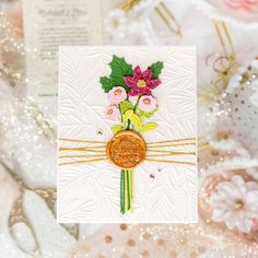 a close up of a card with flowers on it