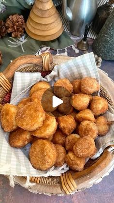 a basket filled with donuts sitting on top of a table