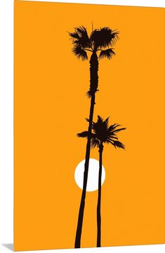 two palm trees against an orange sky