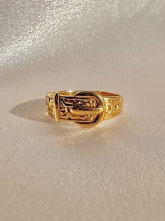 Vintage 9k yellow gold belt buckle ring from Birmingham, England. The belt buckle was a popular motif during the Victorian era in which it symbolized ones love being fastened for eternity. Excellent vintage condition Size: 7.75 resizable* Weight: 3.1 grams Band: 7.7 mm (front), 3.0 mm (back) Hallmarks: 375 for 9k, anchor for Birmingham Belt Buckle Ring, Vintage Gold Jewelry Aesthetic, Cool Piercing Ideas, Vintage Jewelry Aesthetic, Gold Vintage Rings, Cute Bracelet Ideas, Cool Piercing, Belts Aesthetic, Cool Rings