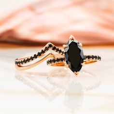 a black diamond ring on top of a table