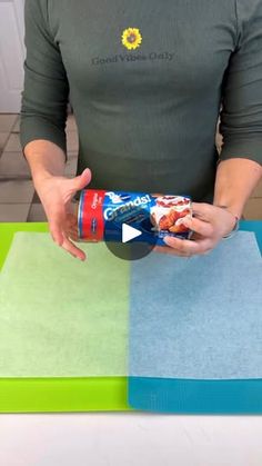 a woman holding a can of food on top of a cutting board