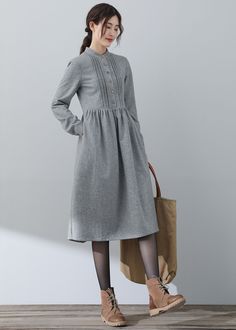 Winter Knee-length Dresses With Button Cuffs, Stand Collar Dress For Winter Workwear, Winter Long Sleeve Midi Dress With Pockets, Winter Workwear Dress With Stand Collar, Knee-length Winter Dresses With Button Cuffs, Long Sleeve Winter Dresses With Side Pockets, Long Sleeve Dresses With Side Pockets For Winter, Winter Midi Dress With Pockets, Gray Buttoned Dress For Fall