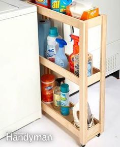 a kitchen cart with cleaning products on it next to a dishwasher and washing machine