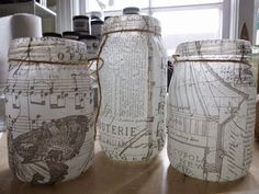 three jars sitting on top of a wooden table