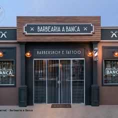 an image of a barber shop with lights on the front door and outside windows that read barbeque e tattoo