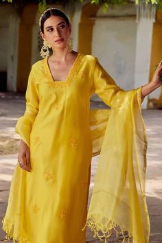 Mustard yellow kurta with floral embroidery and side slits. Paired with palazzo and dupatta.
Components: 3
Pattern: Embroidered
Type Of Work: Floral
Neckline: Square
Sleeve Type: Three quarter
Fabric: Chanderi silk
Color: Yellow
Other Details: 
Tassel border dupatta
Length:
Kurta: 46 inches
Palazzo: 36 inches
Occasion: Puja - Aza Fashions Elegant Yellow Embroidered Sharara, Yellow Tissue Silk Kurta With Zari Work, Yellow Chanderi Kurta With Sheer Dupatta, Elegant Yellow Salwar Kameez With Resham Embroidery, Yellow Tissue Silk Kurta For Diwali, Embroidered Yellow Dola Silk Palazzo Set, Yellow Tissue Silk Kurta With Resham Embroidery, Yellow Resham Embroidery Kurta In Tissue Silk, Yellow Tissue Silk Salwar Kameez For Eid