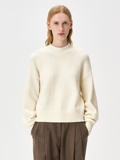 This cozy wool-blend turtleneck sweater features a semi-oversized silhouette perfect for versatile styling throughout the cold seasons. The premium fabric blend combines 70% acrylic with wool, nylon, and spandex for the ideal balance of warmth and comfort. Available in beige and black, this sweater can be worn solo or layered, making it an essential addition to any fall/winter wardrobe.Color: beige, black, cream Wardrobe Color, Oversized Turtleneck Sweater, Oversized Turtleneck, Fall Winter Wardrobe, Beige And Black, Cold Season, Oversized Silhouette, Winter Wardrobe, Black Cream