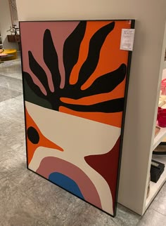 an abstract painting on display in a store