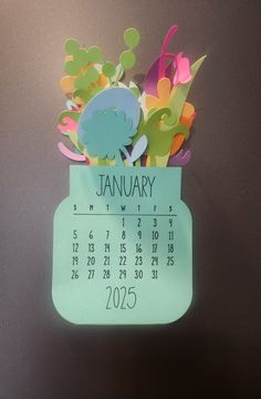 a blue calendar with flowers in it