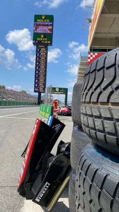 a pile of tires sitting on the side of a road