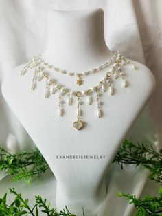 "Princesscore White Beaded Grunge Necklace is crafted with white glass pearls, zircon heart pendant and gold plated  brass chains and accents . It is 14\" and has an extansion chain. If you want to change the length,I can customize this product for you.  Please do not wear the necklace while sleeping, showering or doing sports. I advise you to try to keep it away from water, chemicals and perfumes. If you have any request please do not hesitate to ask. Thanks for stop by For more visit my shop: Cottagecore Necklace, Fairycore Necklace, Necklace Grunge, Grunge Necklace, Grunge Fairycore, White Beads, Brass Chain, Necklace Handmade, White Glass