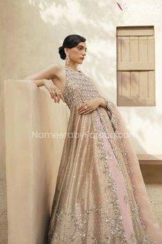 Gown Bridal Lehenga Peach Bridal Dress Pakistani is the epitome of elegance and charm and is embellished with shimmering silverwork and classic adornments. This royal masterpiece wins everyone's hearts at the very first glance by its grace and style. Zardosi work and handcrafted details make this Pakistani Bridal Dress your foremost priority. Gown: Pakistani Bridal Gown in the peach shade is embellished with zardosi, sequins and crystals work. The luxurious tissue fabric makes this Front Open Go Bridal Dress Pakistani, Front Open Gown, Nameera By Farooq, Pakistani Gown, Pakistani Lehenga, Pakistani Bridal Dress, Dress Pakistani, Eid Dress, Raw Silk Lehenga