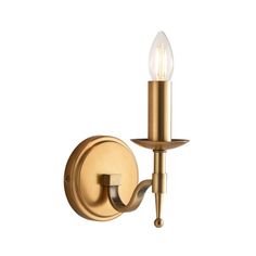 a brass wall light with two lights on each side and a single candle in the middle