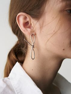 Editor's Notes The basic details express a modern classic mood it can be styled with any outfit for natural daily look.- Modern chic curved earring (single)- Can create a style that you want- Hand-made item- 925silver and 14&18k gold plated- Daily point itemMeasurements(in.)ONE SIZE- Length 2.4in.*0.4in.Composition & Care- 92.5 silver plated 18k gold- Keep it in a pouch- Keep it from moistureDesigner- by HYEON.K Classic Mood, Knot Earrings, Accessories Jewelry Earrings, Modern Chic, Daily Look, Women Accessories Jewelry, Modern Classic, Silver Plate, Silver Plated