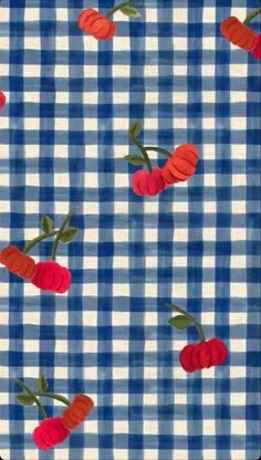 a blue and white checkered fabric with cherries on it