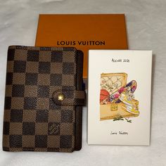 Damier Ebene Agenda In Excellent Condition. Only Call Out Is A Tiny Spot Of Tarnish On The Button. She Looks Like New! Date Code Is Ca0064. The Agenda Is Vintage From 2004. She Comes With A Brand New 2024 Lv Calendar (Diary) Set. Each Month Features Beautiful Art. Nib. Louis Vuitton Office, Louis Vuitton Planner, Calendar Diary, Office Calendar, Louis Vuitton Agenda, Louis Vuitton Brown, Damier Ebene, The Button, Beautiful Art