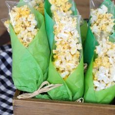 three bags filled with popcorn sitting on top of a table