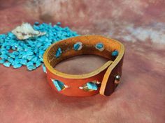 Trinity Wide Leather Cuff Bracelet, Turquoise Wrist Band, Men's Women's, South Western Native American Style Bracelet width 27 mm / 1 inch All my leather art pieces are made by hand. If you want to change the design, I will gladly do it for you. Western Style Cuff Jewelry For Gift, Western Style Turquoise Leather Bracelets, Western Style Blue Cuff Bracelet Gift, Western Leather Bracelet As A Gift, Adjustable Turquoise Western Bracelet, Western Style Leather Bracelets For Gift, Western Style Leather Bracelets As Gifts, Western Style Leather Bracelet Gift, Southwestern Turquoise Leather Bracelet As Gift