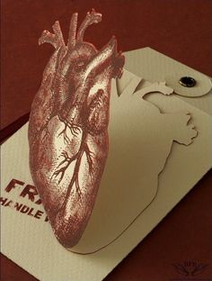 a card with a heart cut out of it