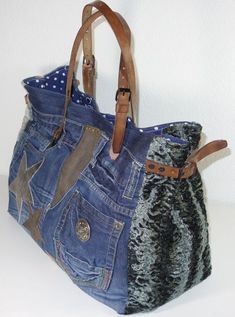 a handbag made out of old jeans and other fabric material is displayed on a white surface