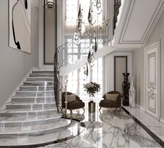 an elegant staircase with chandelier and marble flooring in a white walled entryway