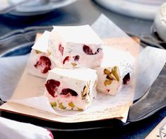 three pieces of cake sitting on top of a plate