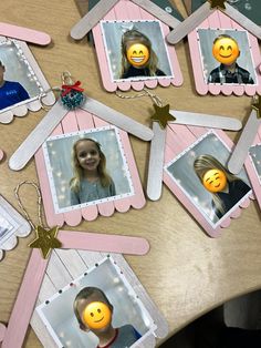 a table topped with pictures of children's faces