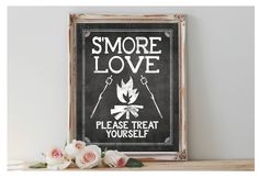 there is a sign that says smore love please treat yourself and flowers are in front of it