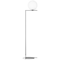 a floor lamp with a white ball on the top and a black base, against a white background