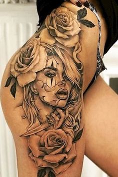 a woman's thigh with roses on it