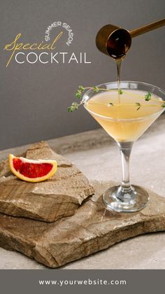 a drink being poured into a martini glass with grapefruit and garnish