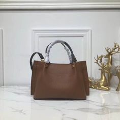 SHOP MORE LUXURY PRODUCTS HERE Description Valentino Small Vlogo Escape Brown, For Women, Women’s Bags 16.1in/41cm Size: 41 x 25 x 18 cm /16.1 x 9.8 x 7.1 inches (Width x Height x Length) Made of textured with VLOGO plaqueAdjustable and removable shoulder strapTwo handlesFront detail with magnetic closureFinish hardwareNon-removable front detail Includes dust bag.This product is of the premium quality. High-end Tan Satchel Bag, Designer Medium Bags For Daily Use, High-end Tan Crossbody Bag, High-end Everyday Bag With Top Carry Handle, High-end Bag With Top Carry Handle For Everyday, Brown Light Luxury Tote Bag, Light Luxury Brown Tote Bag, Light Luxury Everyday Bag With Detachable Handle, High-end Bags With Leather Top Handle